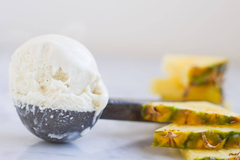 an ice cream scoop with pineapple slices