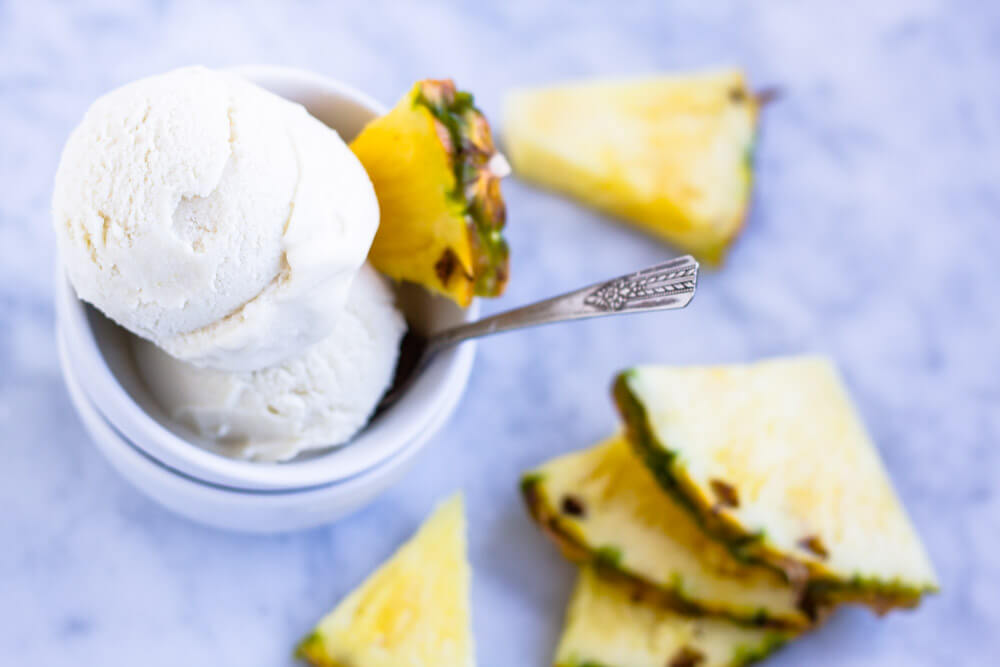 pineapple slices with white bowl of ice cream