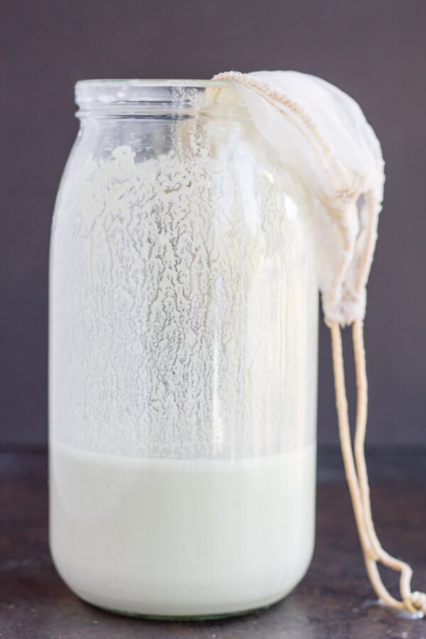 nut milk bag inside a glass jar