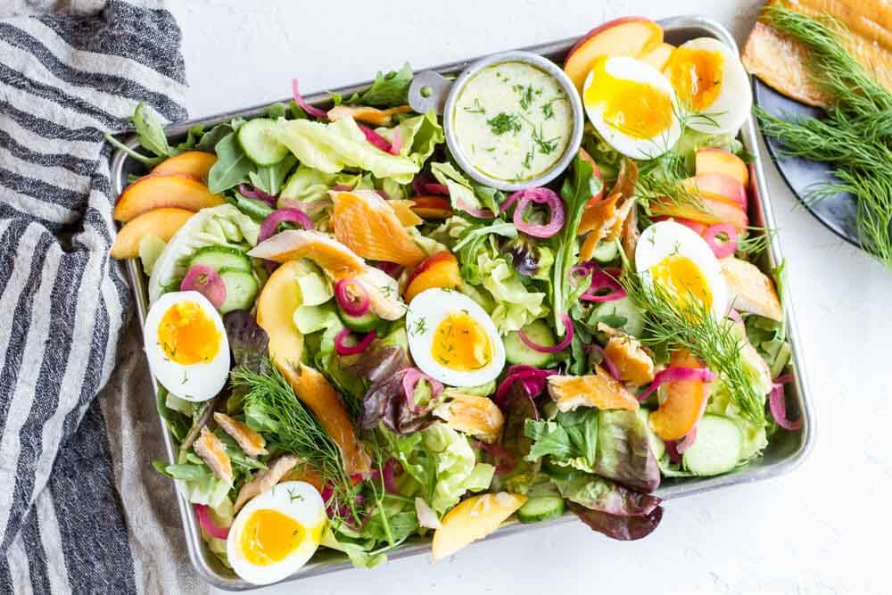 Smoked Trout Salad with Creamy Lemon Dill Dressing on silver baking tray