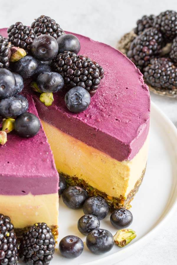 close up of Mango Blackberry Cheesecake on white plate