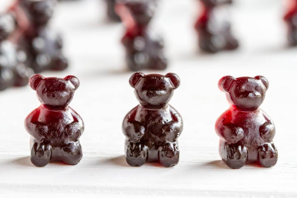 three Elderberry Gummy Bears in a row