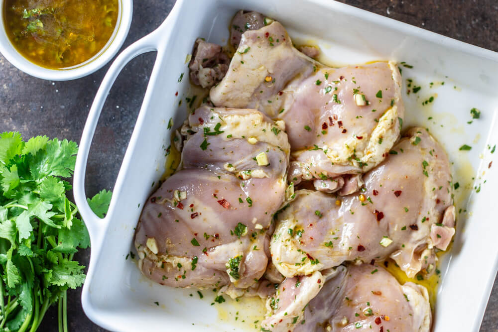 raw chicken in baking dish