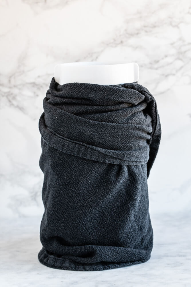 large mason jar wrapped in black towel