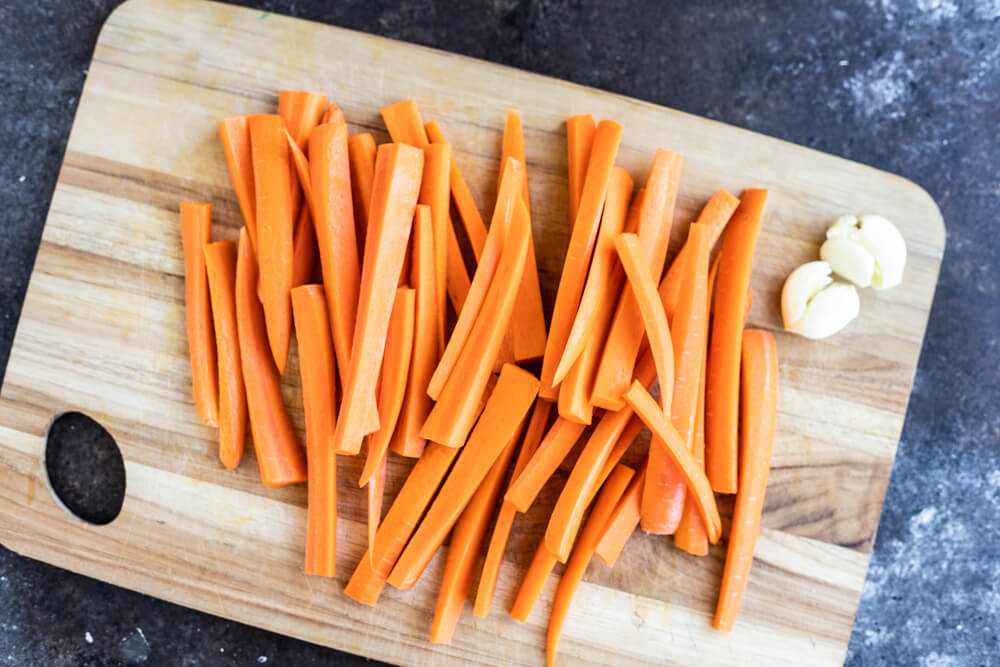 carrots sticks on a cutting board