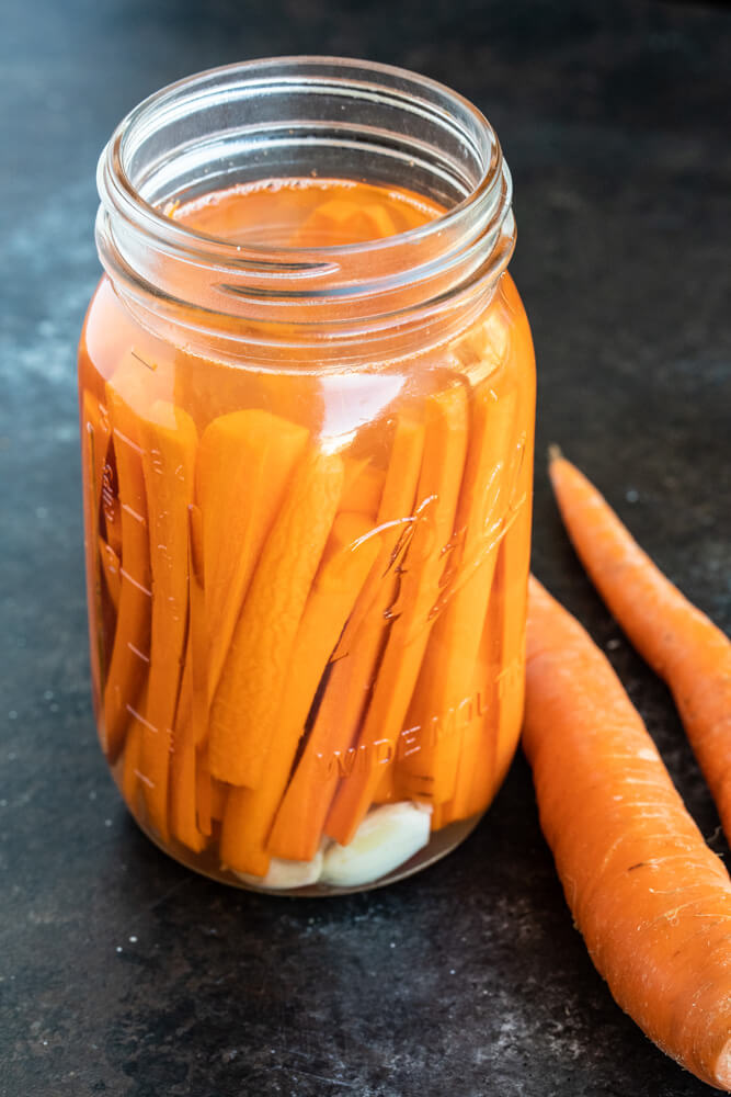 mason jar with fermented carrots inside