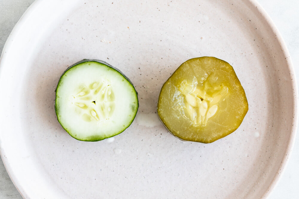 cucumber slice and pickle on a plate