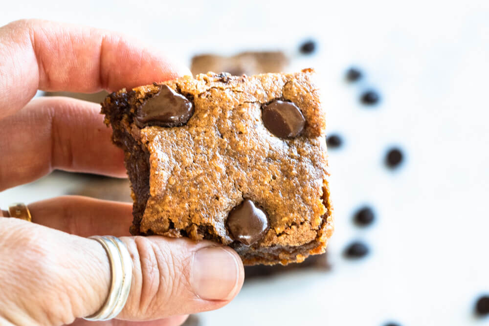 hand holding a chocolate chip pumpkin bar