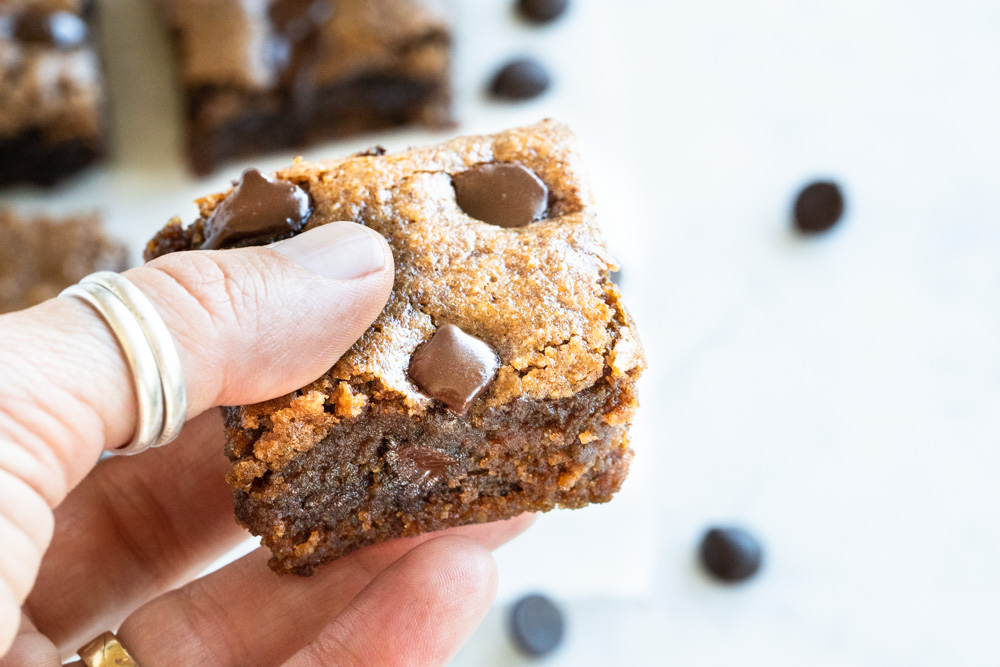 hand holding a pumpkin bar with chocolate chips