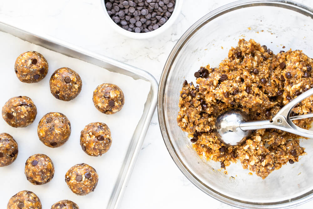 glass bowl with peanut butter pumpkin ball mixture