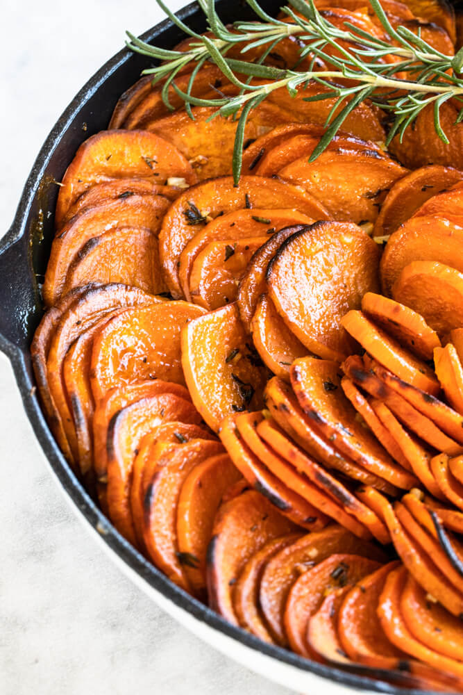 close up of sweet potato slices cooked in butter
