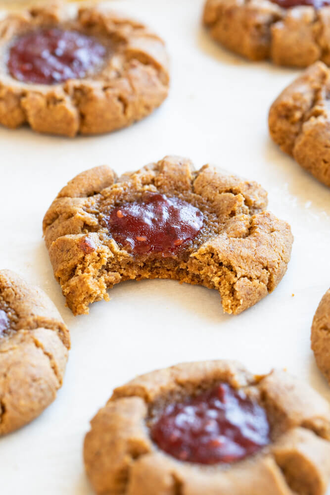 peanut butter and jelly thumbprint with a bite taken out of it