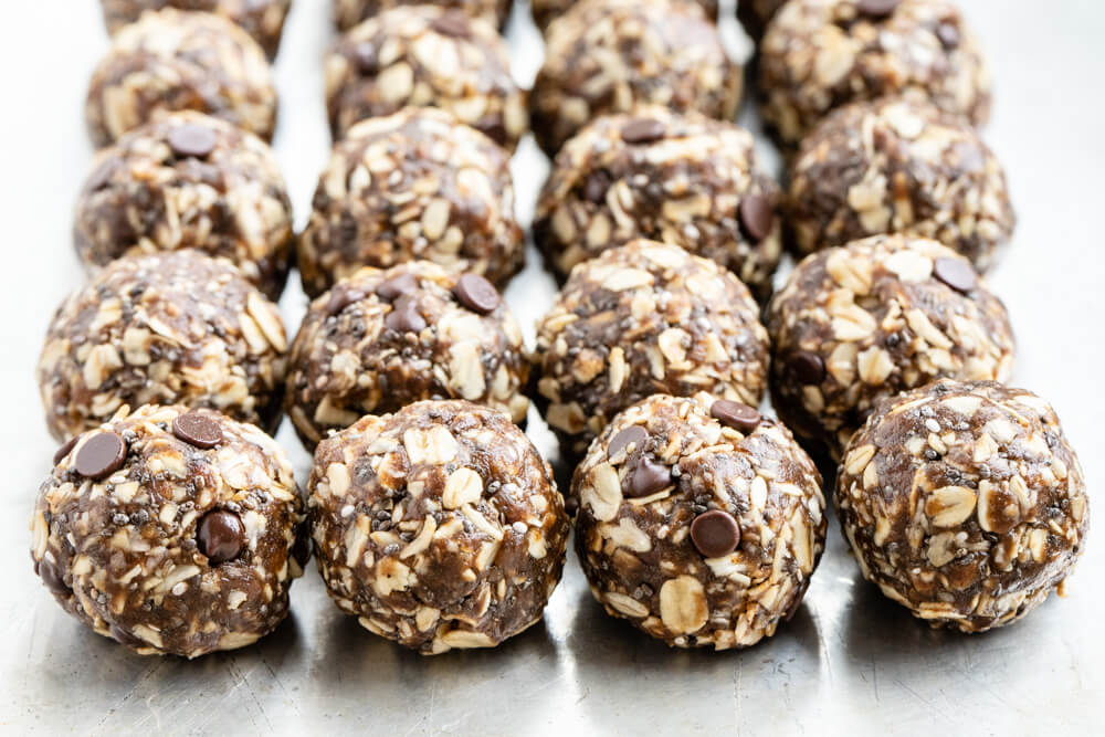 gingerbread energy balls lined up on a silver tray