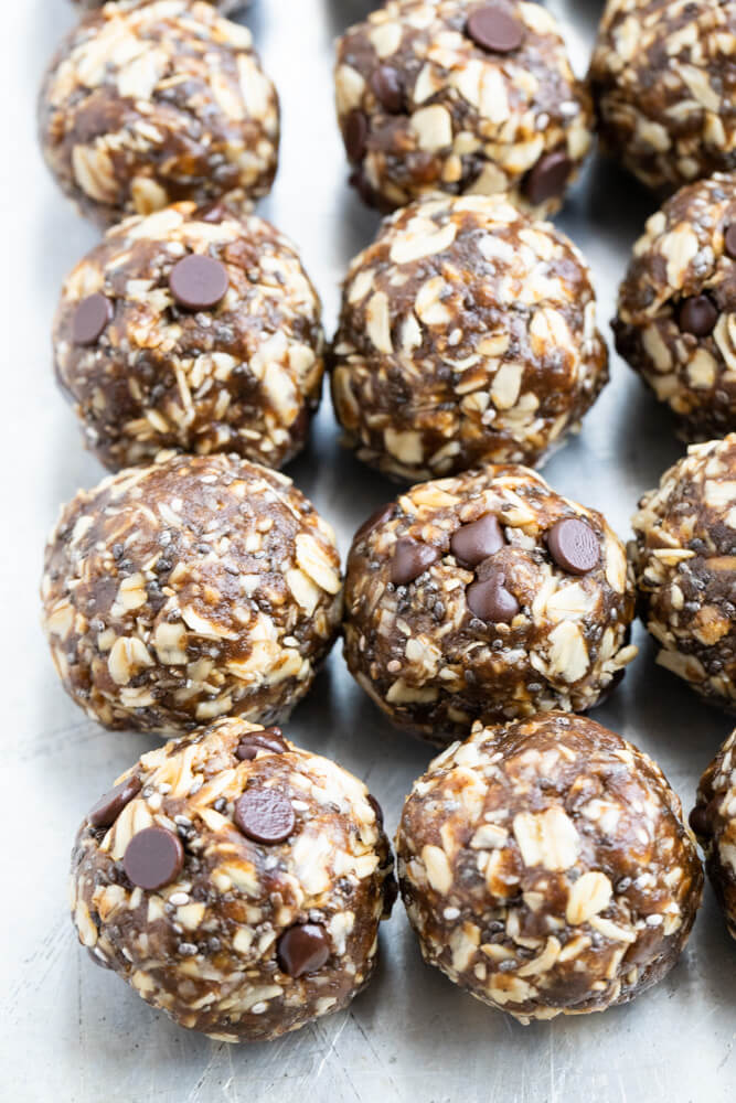 gingerbread energy balls lined up on a baking tray