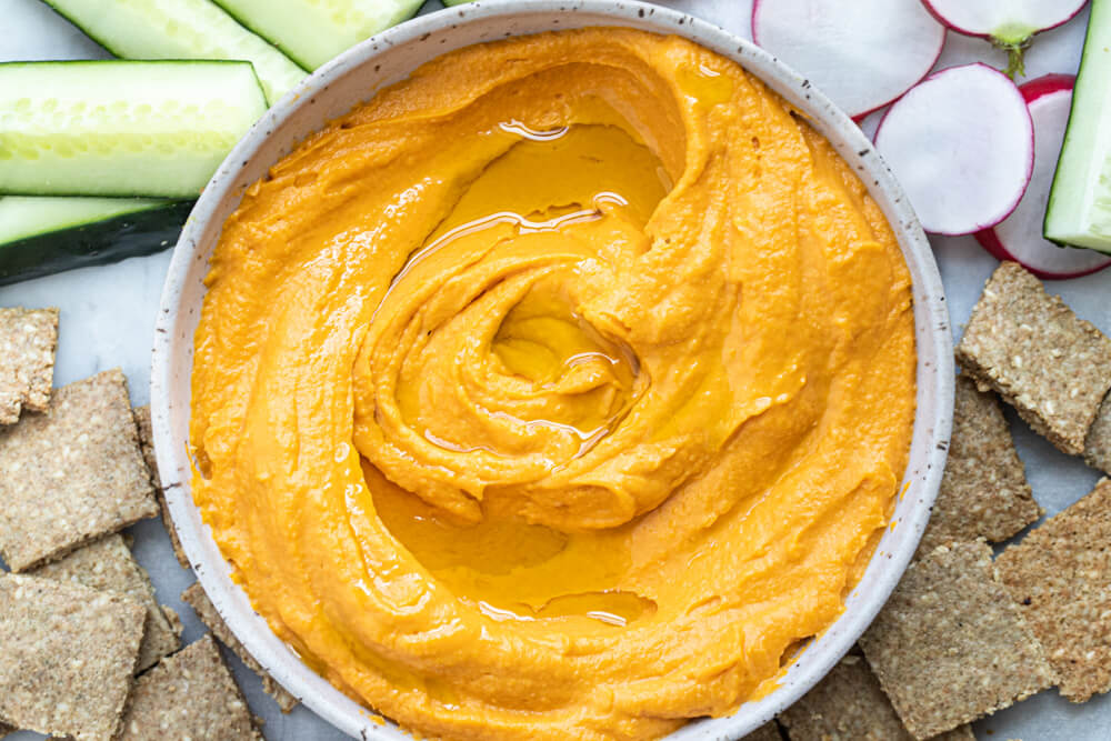 white bowl with sweet potato hummus