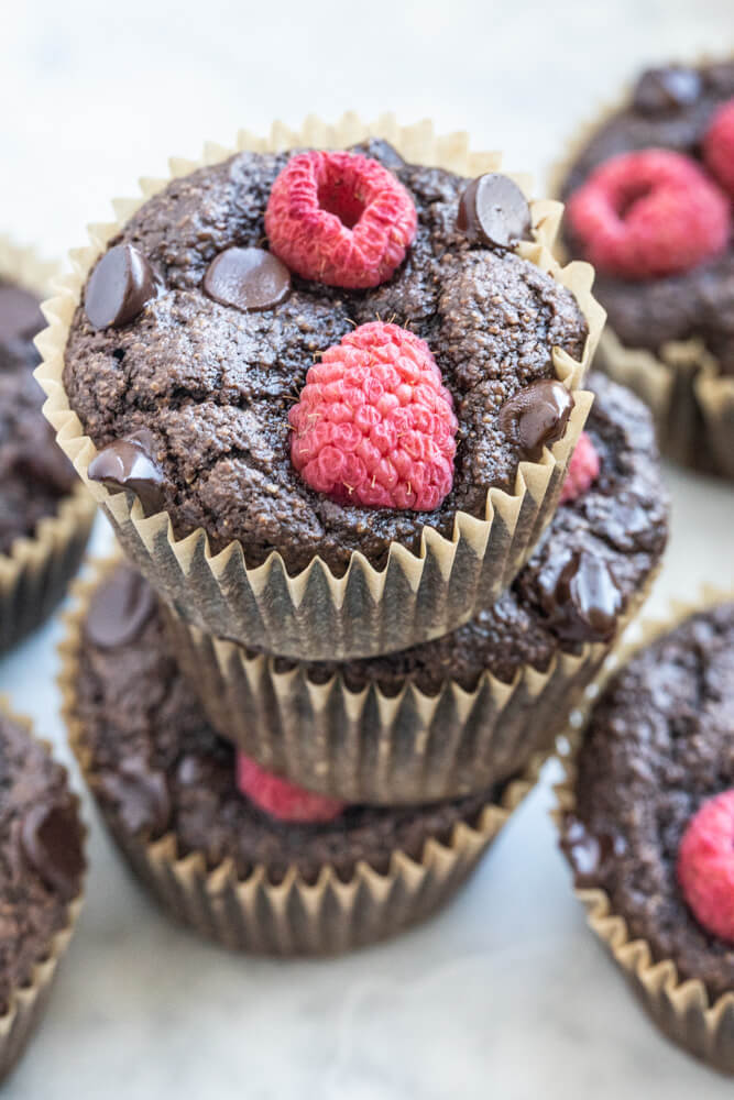 3 vegan chocolate muffins stacked on top pf each other