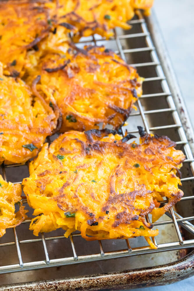 butternut squash fritters on a wire rack