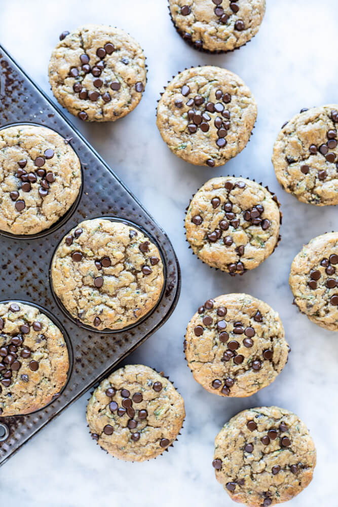 zucchini muffins on white stone counter