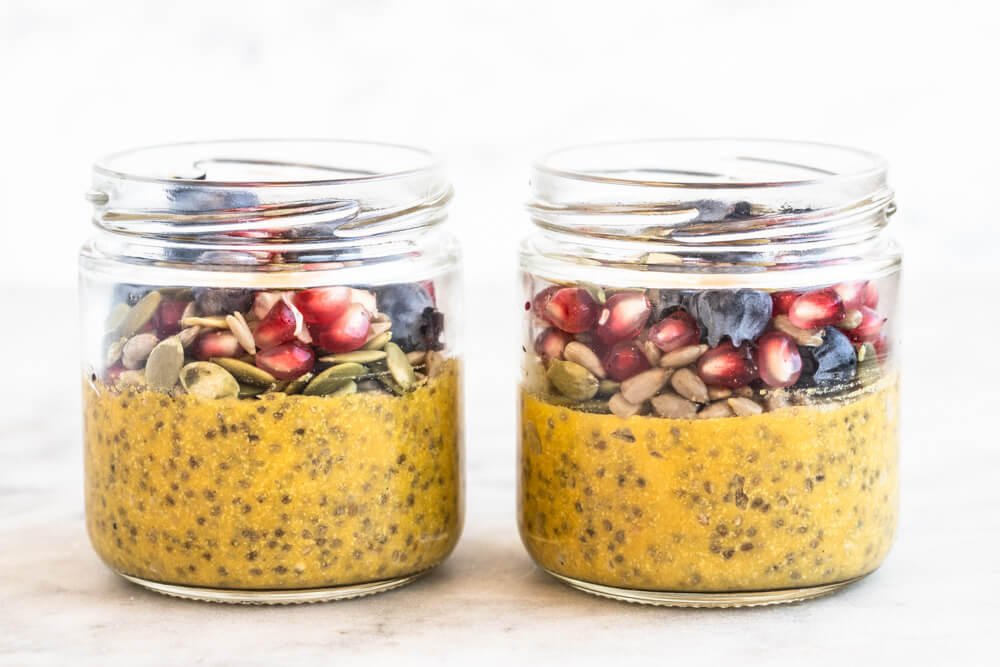 teo glass jars of pumpkin pie chia pudding