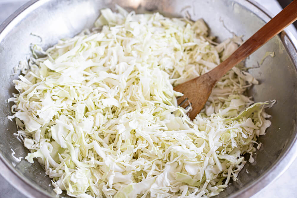 metal bowl with shredded cabbage