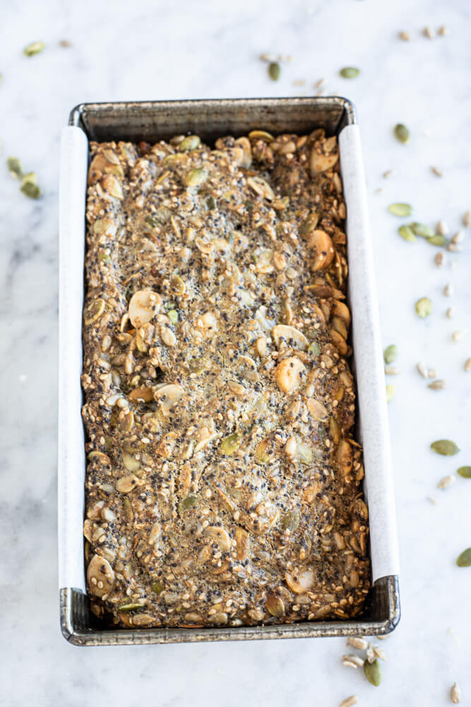 nut and seed bread in a loaf pan