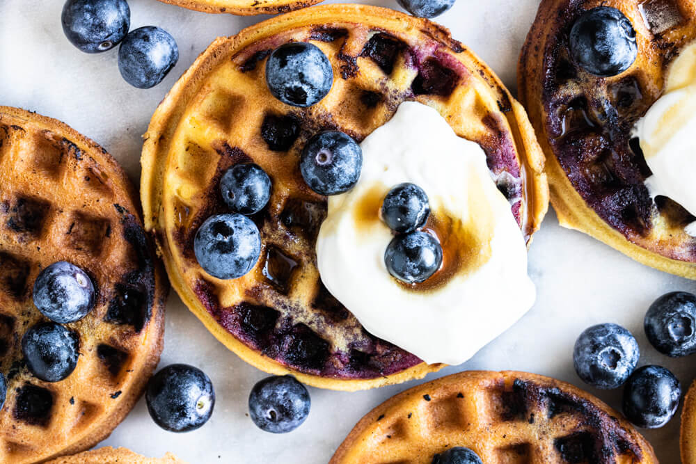 waffle with whipped cream and blueberries
