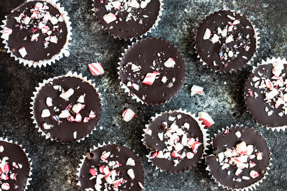 chocolate peppermint cups with candy can sprinkles on black pan
