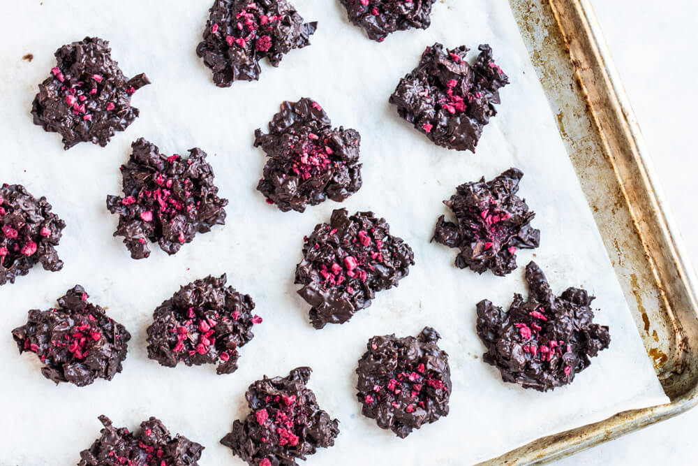 chocolate clusters on white parchment paper