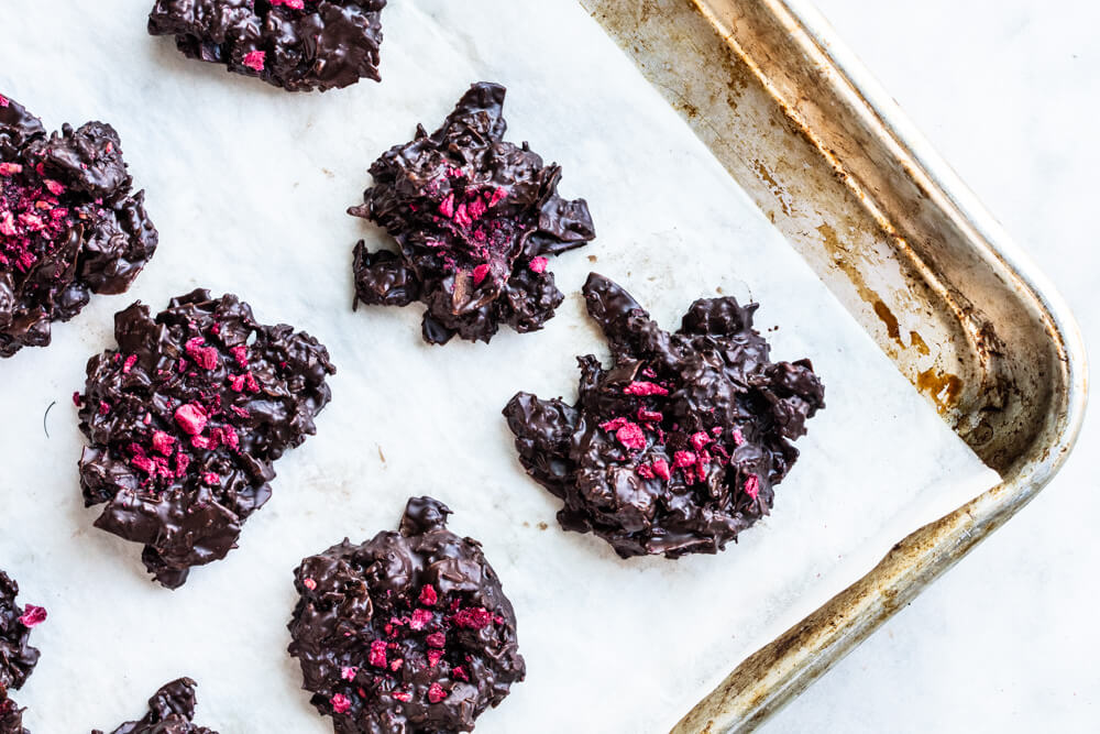 chocolate clusters on a metal baking sheet