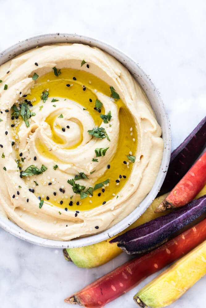 red lentil hummus with olive oil drizzled on top