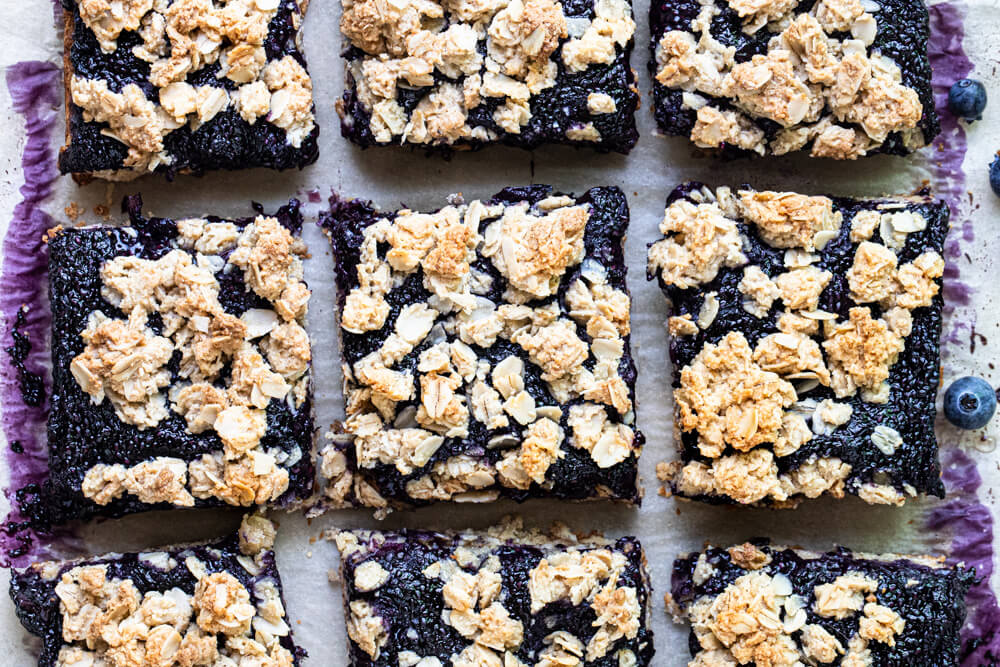 blueberry bars on parchment paper