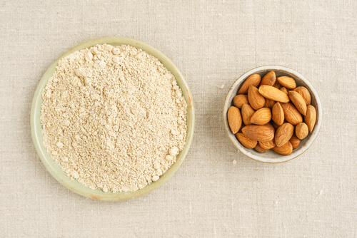 almond flour next to a bowl of almonds