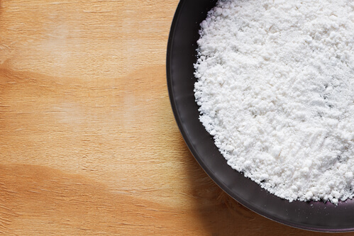 cassava flour in black bowl