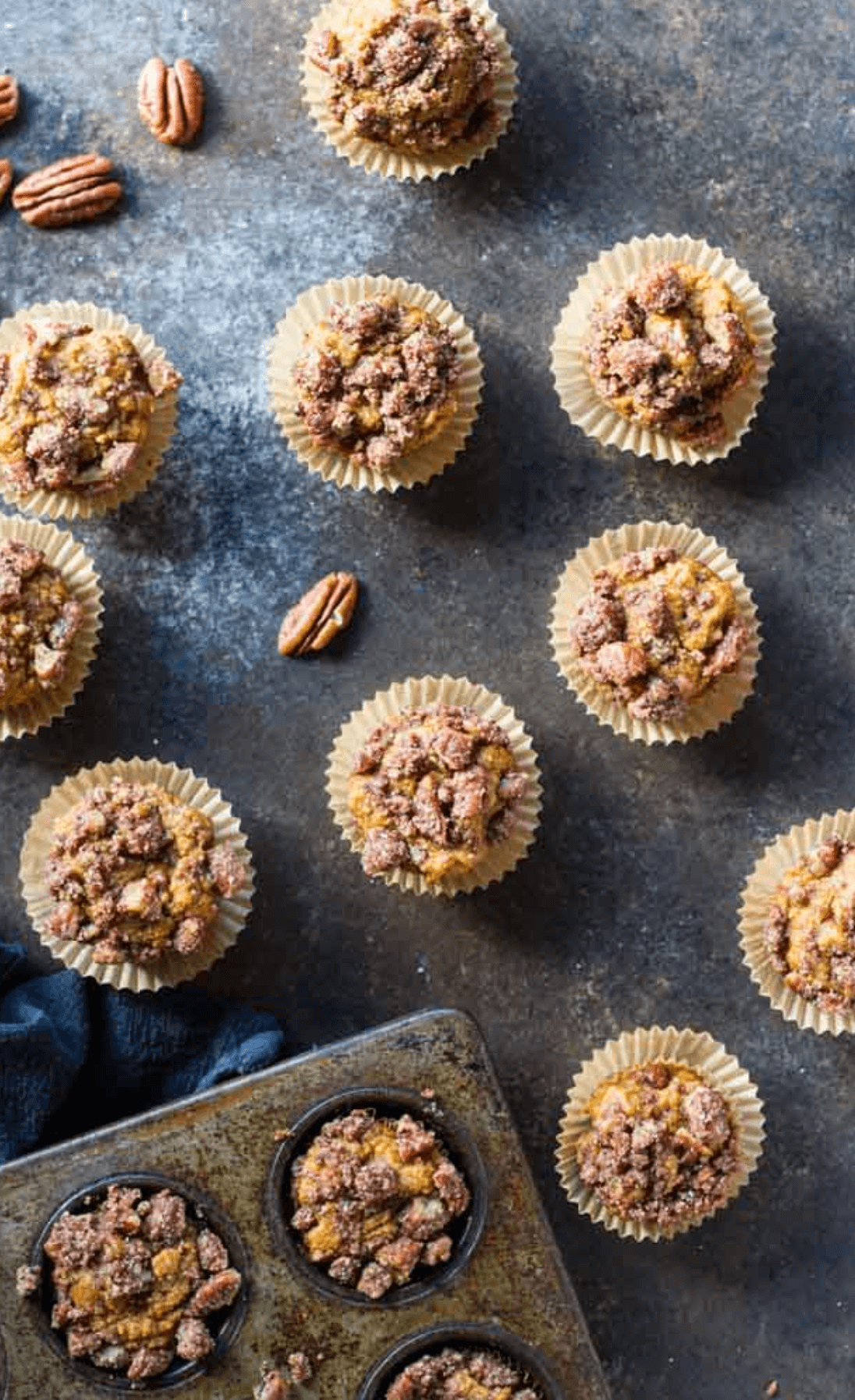 mini pumpkin muffins next to muffin pan